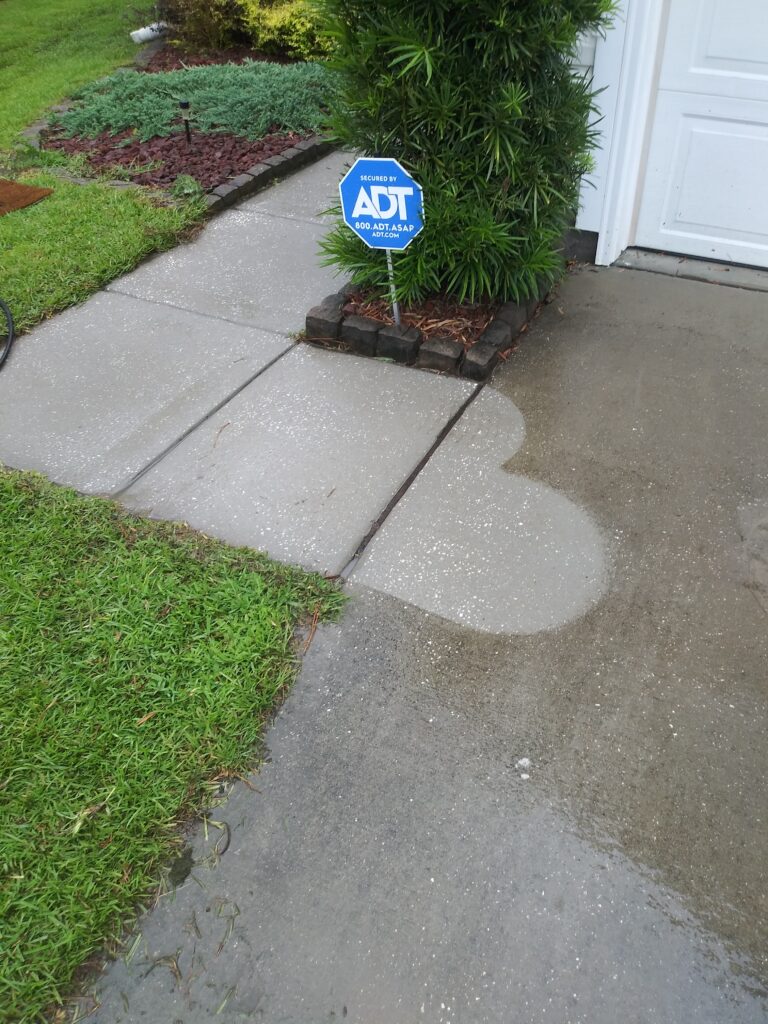 Driveway surface cleaning in process